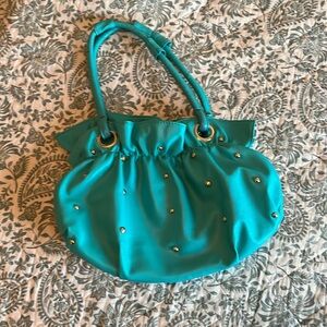 Aqua bag with silver studs.
